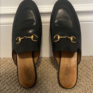 Gucci Black Leather Mules with Gold Bit Detail